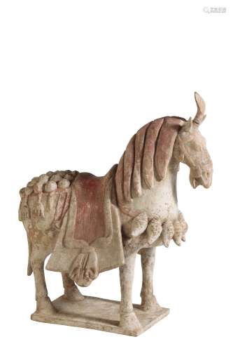 PAINTED POTTERY FIGURE OF A CAPARISONED HORSE, NORTHERN QI DYNASTYN