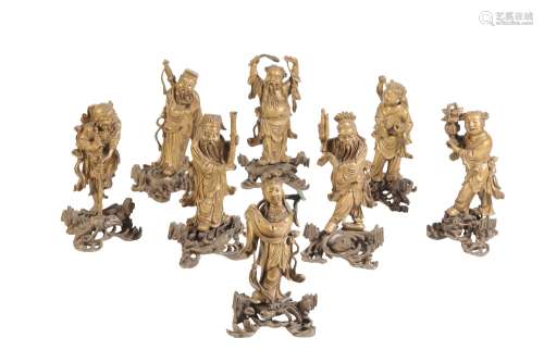 SET OF EIGHT GILT-LACQUER FIGURES OF THE DAOIST IMMORTALS, LATE QING / REPUBLIC PERIOD