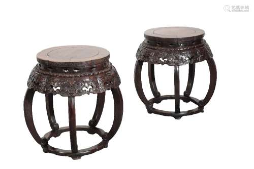 PAIR OF CARVED HUANGHUALI AND ROSEWOOD BARREL STOOLS, QING DYNASTY