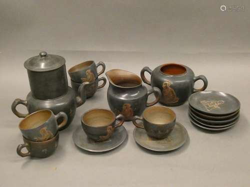 Terracotta tea set including a teapot, 6 cups and 6 saucers, a sugar bowl