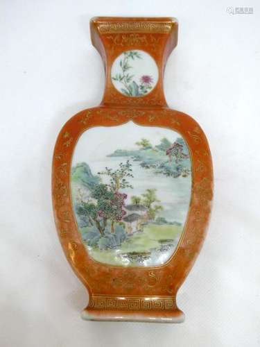 CHINA Porcelain vase with a landscape decoration in a medallion on an ochre enamelled background. Ht: 20cm