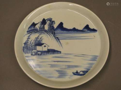 CHINA Blue and white porcelain plate decorated with a mountain landscape. Diam : 26cm