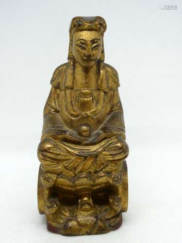 CHINA Gilded wooden subject depicting a seated deity. Ht: 18cm