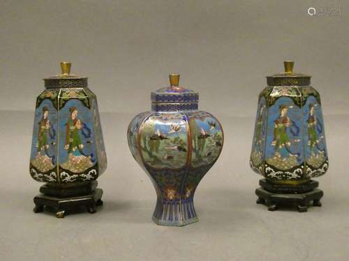 CHINA Suite of three covered bottles in cloisoné enamel with stork and character decoration. H: 12 and 13cm