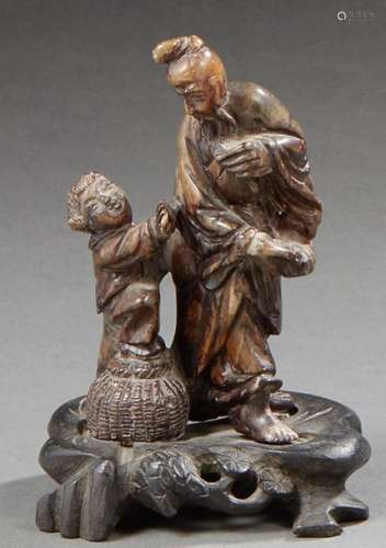 CHINA Steatite group representing a wise man and a child 20th century Dim: 10 cm