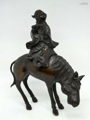 CHINA Bronze group with brown patina showing a Chinese character on horseback. Ht : 22cm