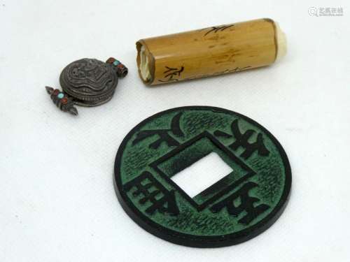 CHINA Set comprising an openwork bronze piece, a small scroll and a silver clasp.