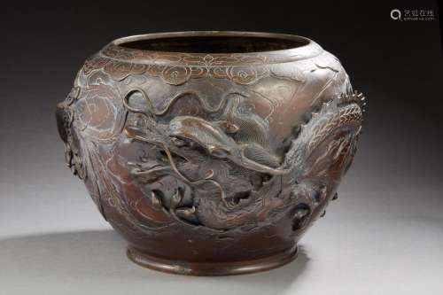 JAPAN Bronze planter with brown-red patina decorated in light relief with a phoenix and a dragon. Meiji period