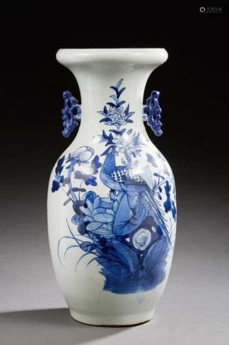 CHINA Porcelain baluster vase decorated in blue with a pheasant on a rock with flowers. XXth century Size: 43 cm