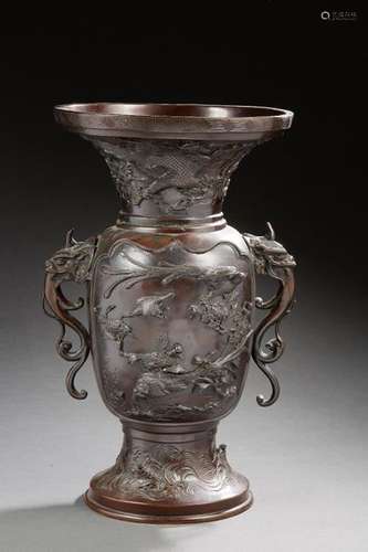 JAPAN Large bronze vase with brown patina and two handles formed by dragons, decorated with birds in light relief. Meiji period