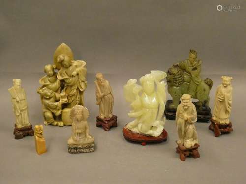 CHINA Set of nine hard stone statuettes including characters, seal, Buddha, sages... H. : 22.5 cm