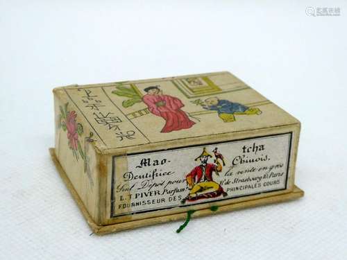 PIVER - Mao Tcha Small rectangular box sheathed in polychrome paper, illustrated with Chinese characters, flowers and ideograms originally containing the toothpaste. Inside a tiny hinged turtle. Dim : 6x4x2cm