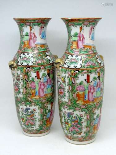 CHINA Pair of polychrome porcelain vases decorated with birds and characters. Ht: 26cm