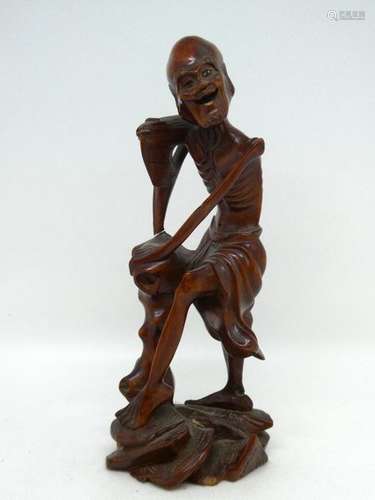 JAPAN Wooden subject showing an old man leaning on a cane. Ht: 23cm