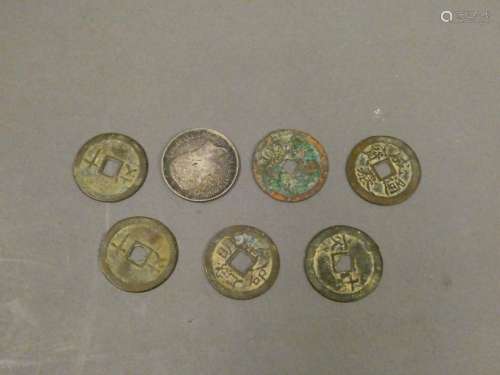 Set of seven Asian coins.