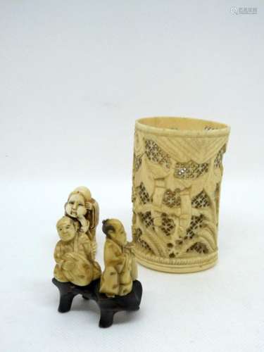 Set of three carved ivories including a brush holder, a netsuke and an inro