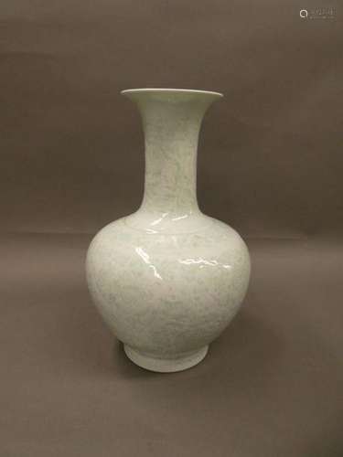 CHINA White enamelled porcelain vase with shadow decoration. H. : 35 cm