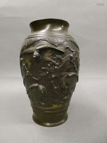 JAPAN Bronze vase with brown patina and gilding highlights with relief decoration of trendy birds. Ht.: 31cm