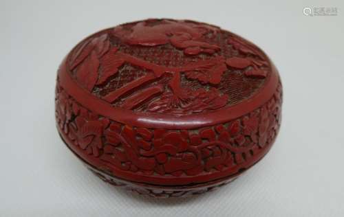 CHINA Round box in red lacquer with a decoration of a child on a bovid. Dim. 5,5 x 9 cm
