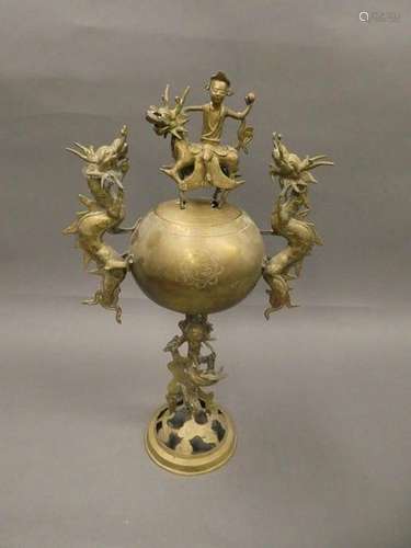 CHINA Bronze perfume burner, the handles depicting dragons, the lid decorated with a rider. Ht.: 46cm