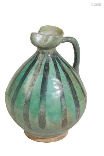 KASHAN GREEN-GLAZED POTTERY EWER, WESTERN PERSIA, 12TH CENTURY