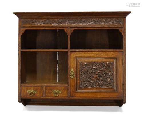 Arthur W. Simpson (1857-1922), an Arts and Crafts carved oak hanging cupboard c.1908, signed on
