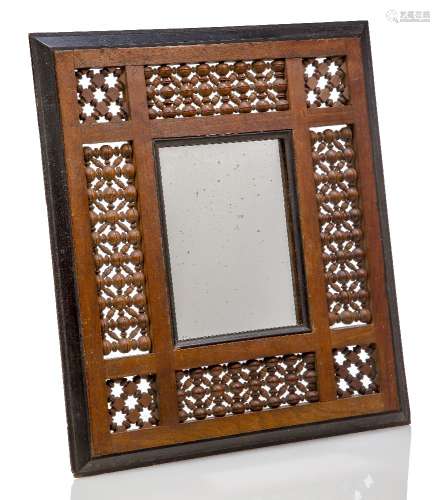 A Mashrabiya framed mirror, possibly retailed by Liberty and Co c.1900, unsigned A Moorish style