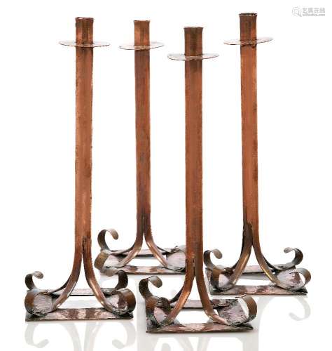 Arts and Crafts (British), a set of candlesticks c. 1900, unsigned A set of four tall copper