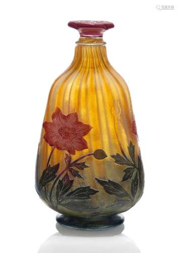 Daum, a cameo glass bottle with flower form stopper c.1902, engraved Daum Nancy with Cross of