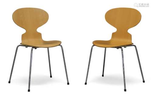 After Arne Jacobsen, a pair of beech 'Ant' chairs for Fritz Hansen c.1997, applied manufacturer's