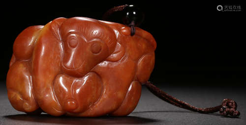 AN AGATE PENDANT CARVED WITH MONKEY