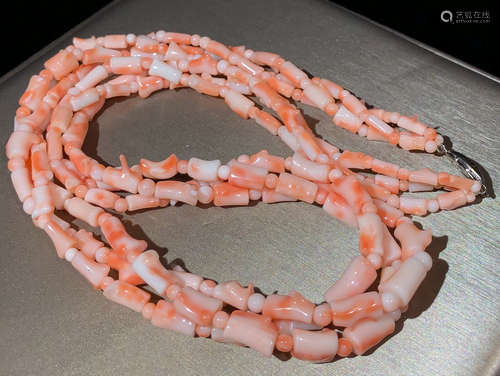 A PINK CORAL STRING NECKLACE