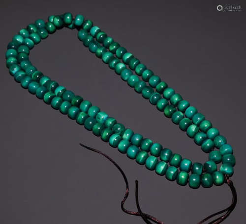 A QIUJIAO STRING NECKLACE WITH 108 BEADS