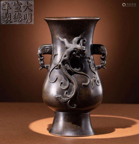 A COPPER VASE CARVED WITH DRAGON