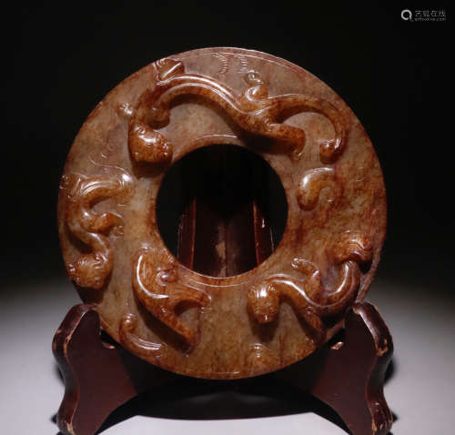 AN ANTIQUE JADE BI CARVED WITH BEAST