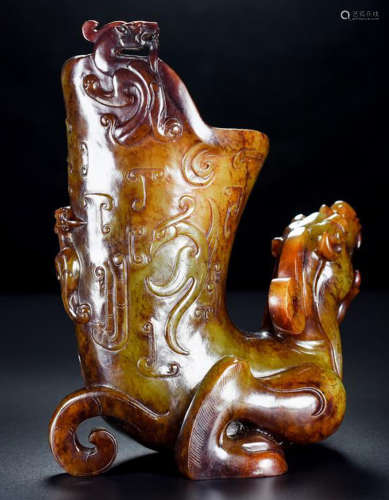 AN ANTIQUE JADE CUP SHAPED WITH BEAST