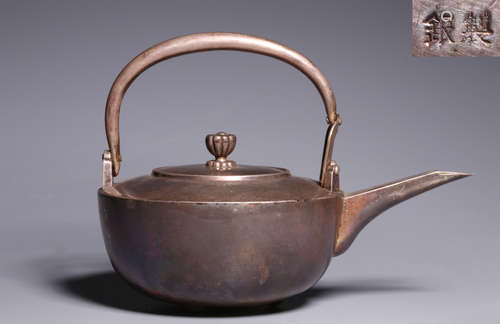 A SILVER TEA POT WITN MARK