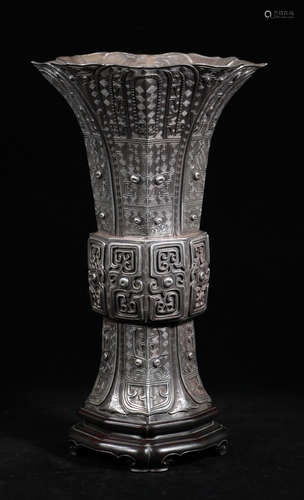 A SILVER VASE CARVED WITH BEAST PATTERN