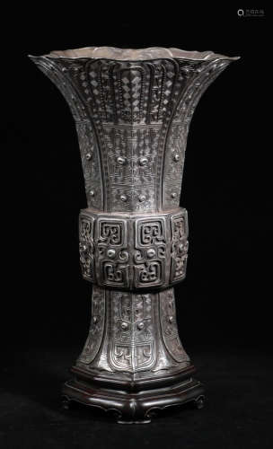 A SILVER VASE CARVED WITH BEAST PATTERN