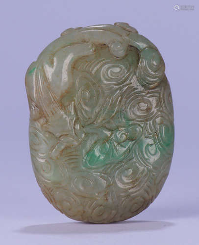 A JADEITE TABLET CARVED WITH BEAST