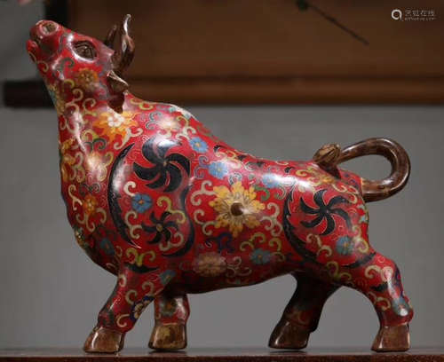 A CLOISONNE COW ORNAMENT WITH FLOWER PATTERN