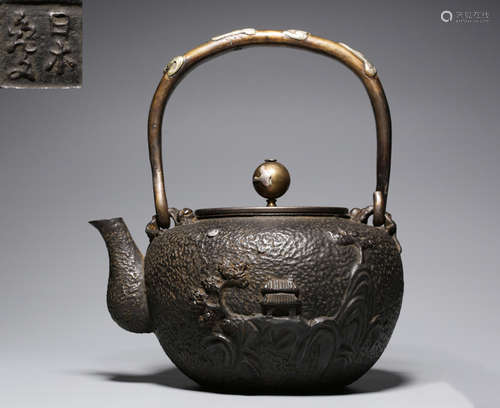 AN IRON POT CARVED WITH LANDSCAPE