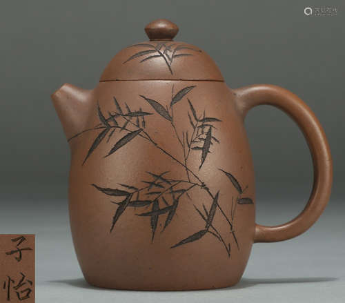 A ZISHA TEA POT CARVED WITH BAMBOO PATTERN