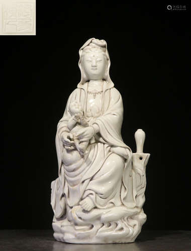 A WHITE GLAZE GUANYIN BUDDHA STATUE