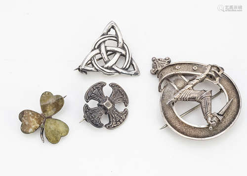 A collection of silver Celtic brooches, including a Connemara marble silver set clover leaf, a