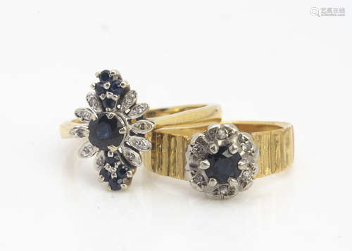 Two 18ct gold sapphire cluster rings, claw set surrounded with eight cut diamonds, both with