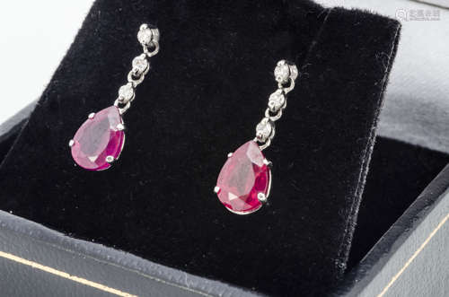 A pair of ruby and diamond drop earrings, pear shaped rubies on diamond chain drops, 1.8cm, boxed,