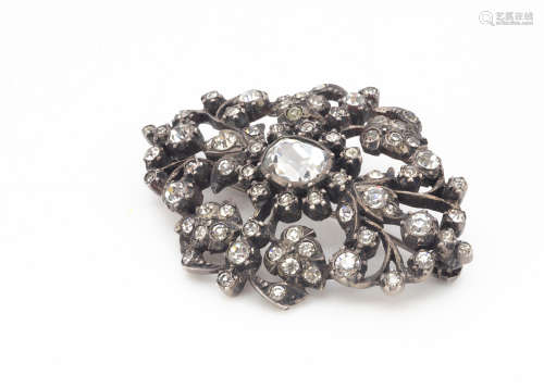 A continental oval openwork paste set brooch, the central oval cut colourless pastes surrounded by
