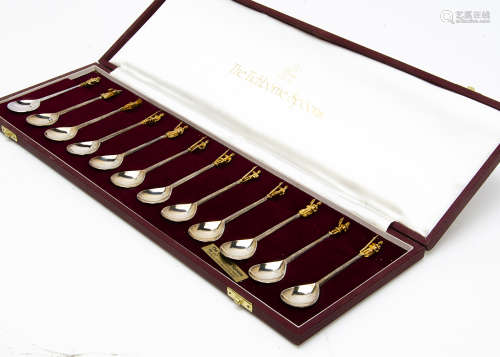 A 1970s set of the Tichborne Spoons, the twelve each with gilt figure to terminal, in box with
