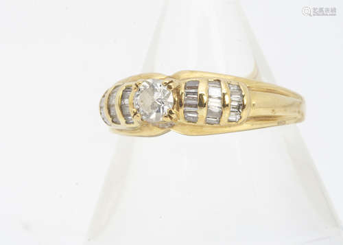 An 18ct gold diamond dress ring, the central round brilliant diamond in claw setting, with diamond